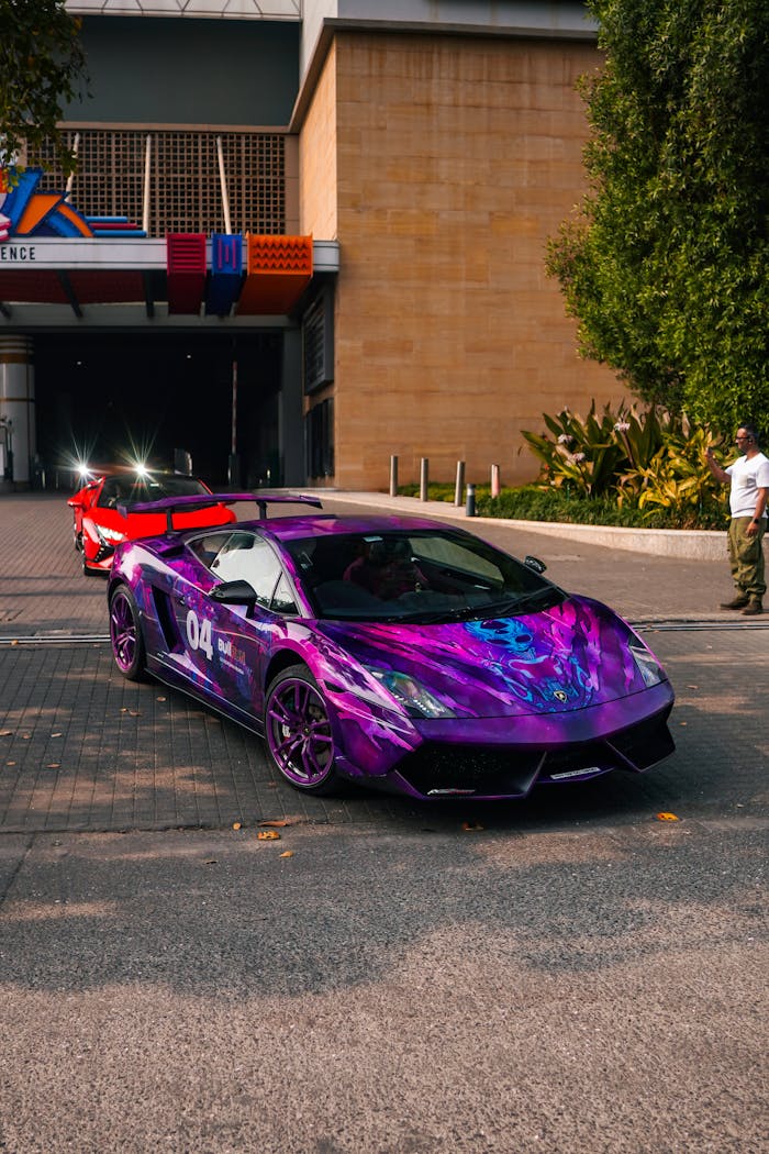 A striking purple sports car parked under vibrant city lights, exuding a modern and energetic vibe.